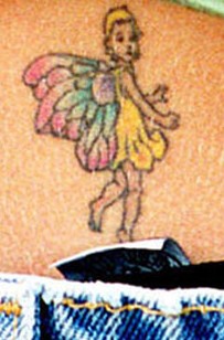 Britney Spears lower back tattoos - small fairy tattoo