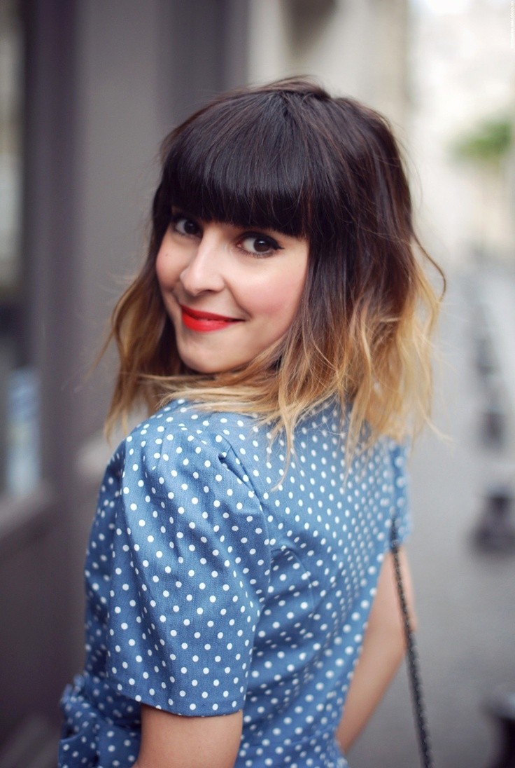 Medium layered hairstyle with blunt bangs