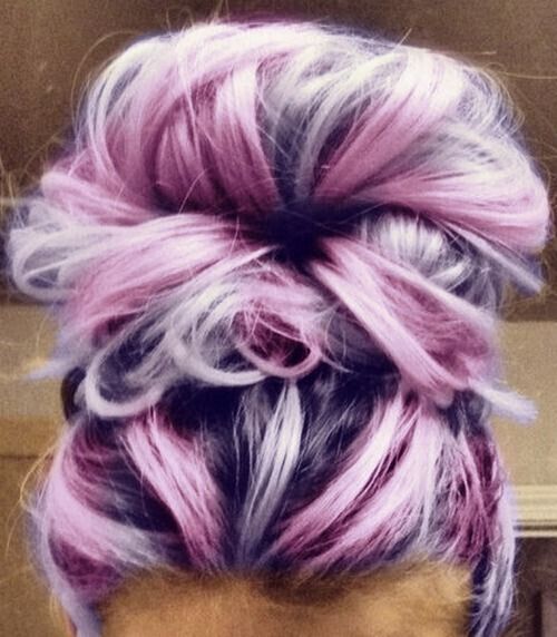 Chaotic top bun hairstyle for purple hair