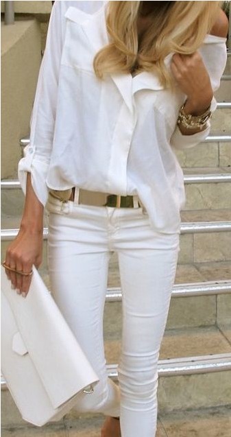 White outfit, white shirt with golden accessories.