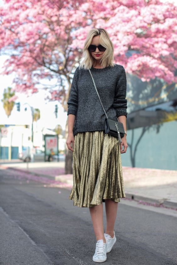 gray sweater-and-metallic skirt over