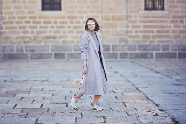 gray sweater and gray trench coat over