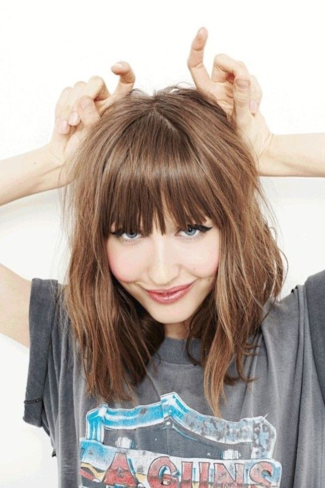 Medium wave hairstyle with blunt bangs