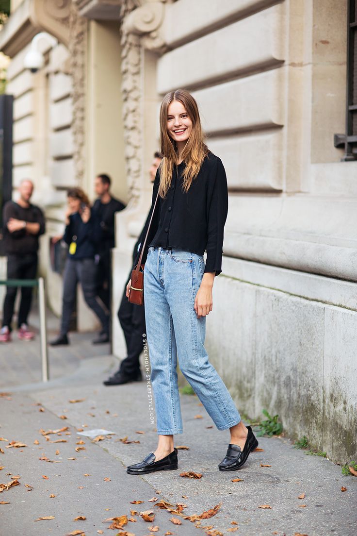 Black top, jeans and black loafers