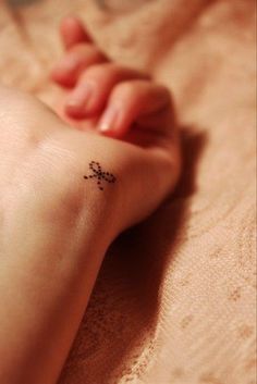 Tiny Bow Tattoo "width =" 480