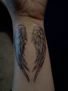 Wings tattoo on the wrist "width =" 480