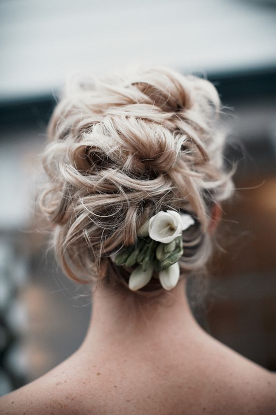 Messy curly wedding updo hairstyle