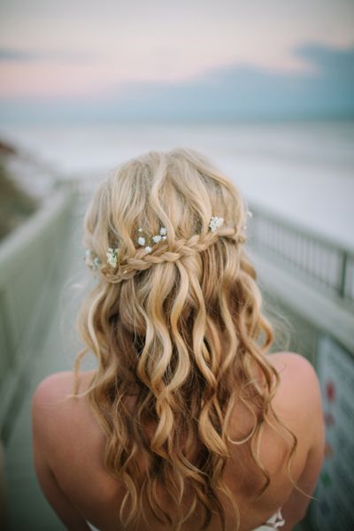 Pretty braided curly wedding hairstyle