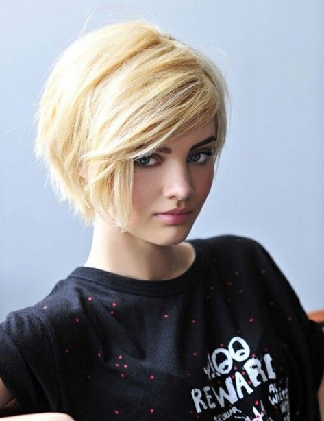 Short blonde haircut with side-swept bangs