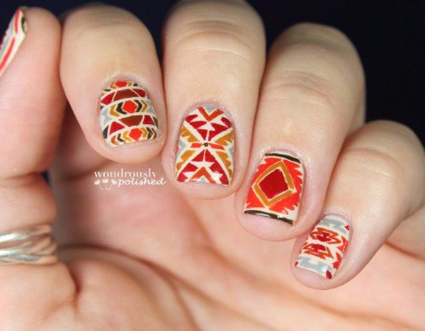 Orange tribal nail design