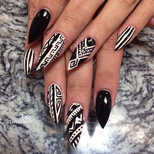 Black and white stiletto tribal nail design