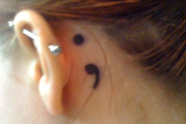 Semicolon behind the ear tattoo