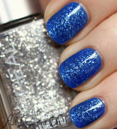 Deep blue nails with glitter