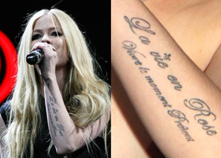 Avril Lavigne Tattoos - romantic French arm tattoo