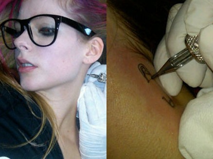 Avril Lavigne Tattoos - safety pin on the neck