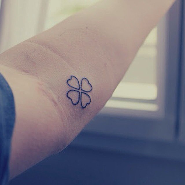 Tiny symbol tattoo