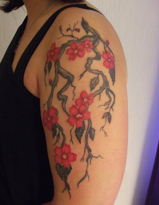 Cherry Tattoos Designs: Pretty flower tattoo on the arm