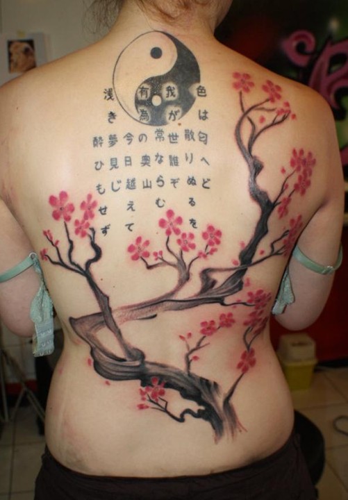 Tattoos designs for women: cherry blossom tattoo on the back
