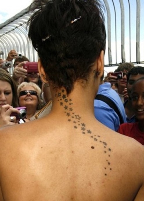 Fantastic star tattoo designs for girls on the back: Rihanna tattoo