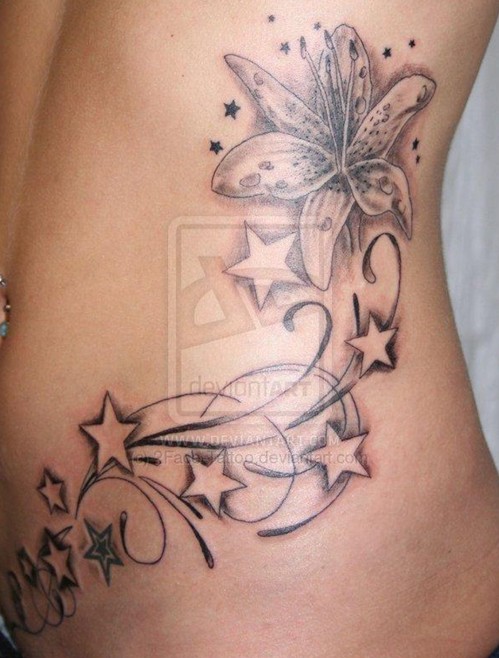 Flower star tattoos on the side of the body