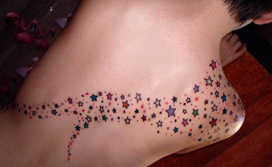 Star tattoo designs: stardust tattoo on the shoulder