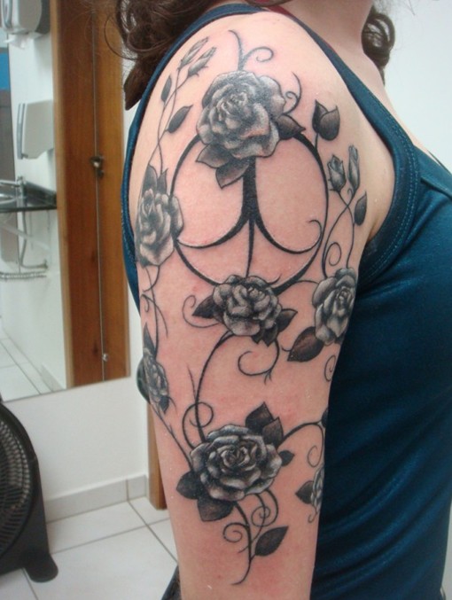 Rose tattoo on the upper arm