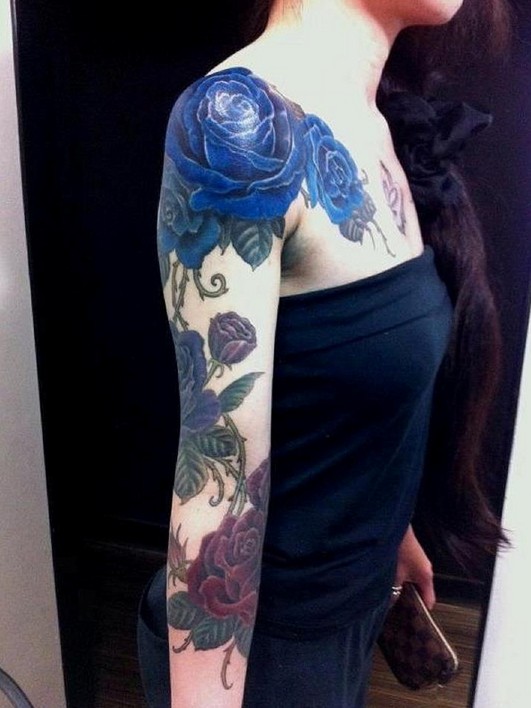 Blue rose tattoo on arm: girl tattoos