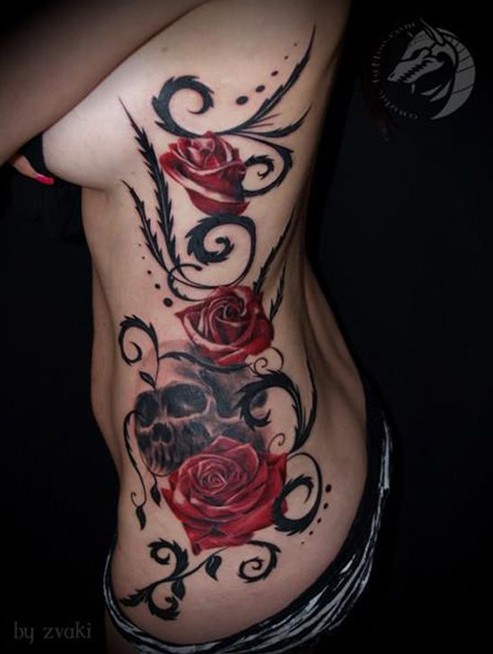 Skull and rose tattoo on the side of the body