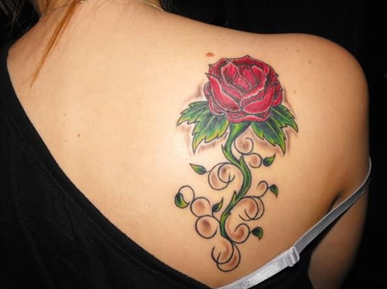 Rose tattoo on the back shoulder