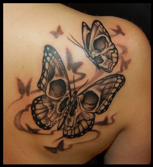 Butterfly girl skull tatoo on the upper back
