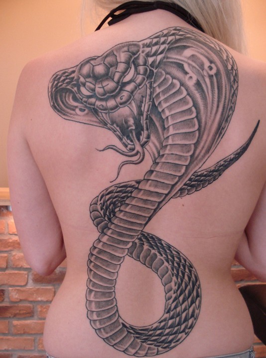 Female snake tattoo on the back