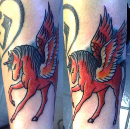 Beth Lucas tattoos - red unicorn by Ash Against
