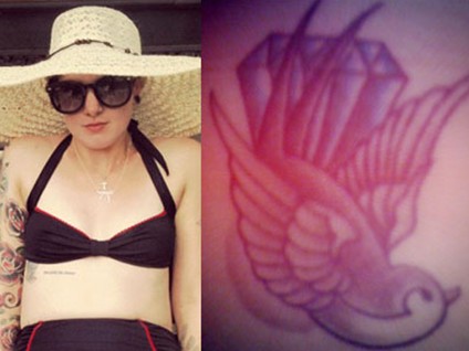 Beth Lucas & # 39; Tattoos - Diamond, Swallow and Lyric on Chest