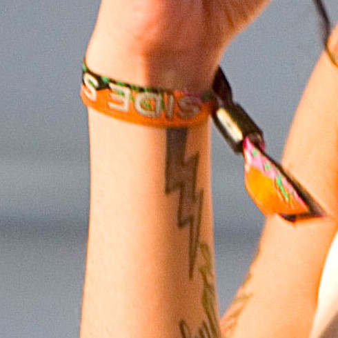Amy Winehouse Tattoos - Lightning tattoo on wrist