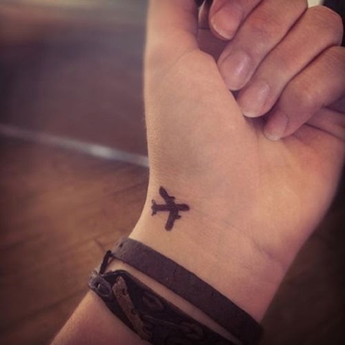 Tiny airplane tattoo