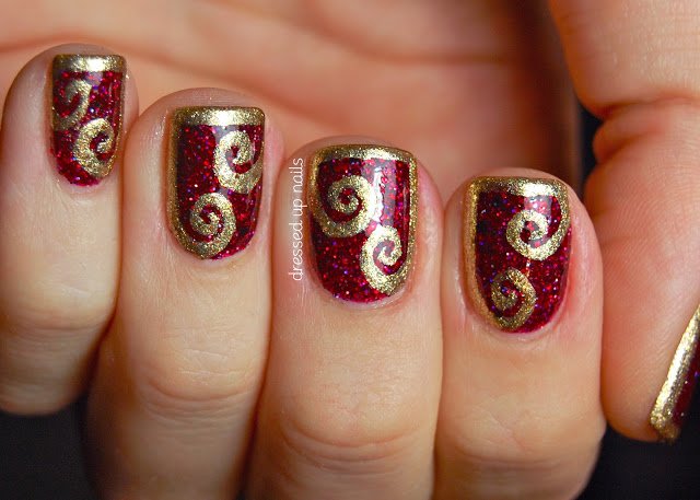 Burgundy Nail Design With Gold Swirl "width =" 450