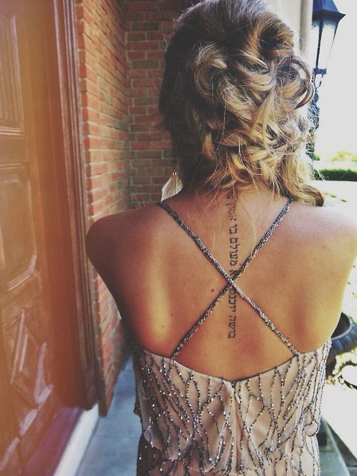 Back written tattoo