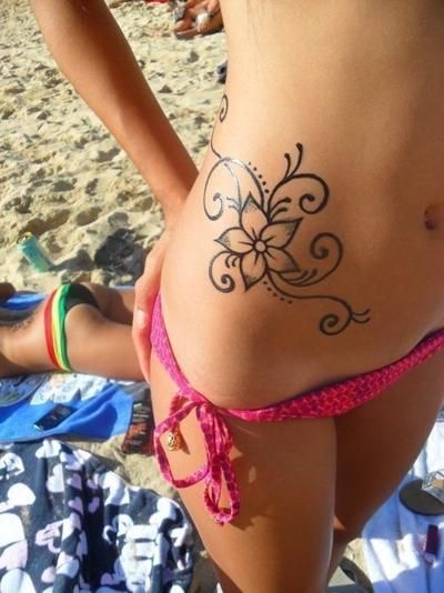 Simple waist flower tattoo