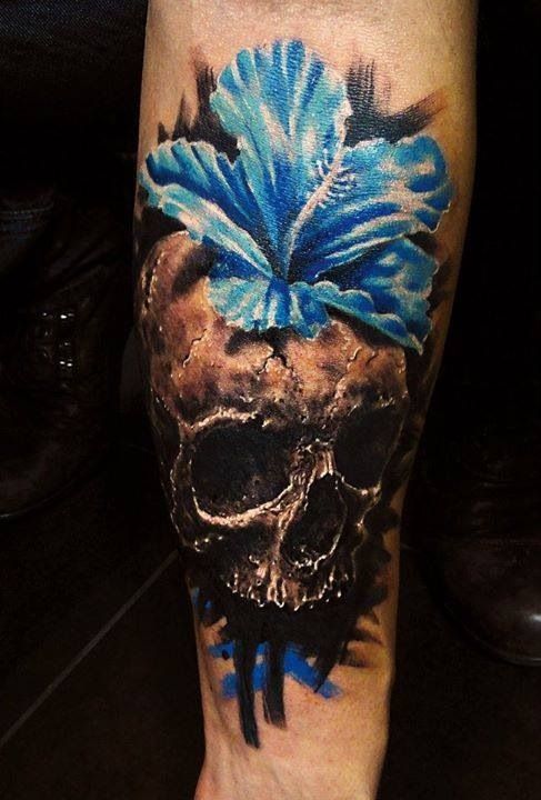 Blue flower and skull tattoo