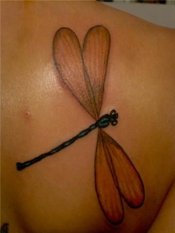 Dragonfly tattoo on the back
