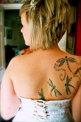 Dragonfly tattoos on the back