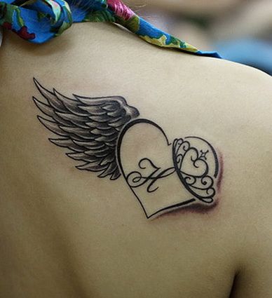 Heart wing tattoo