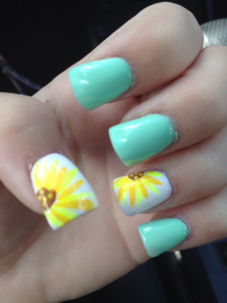 Light blue nails with sunflower