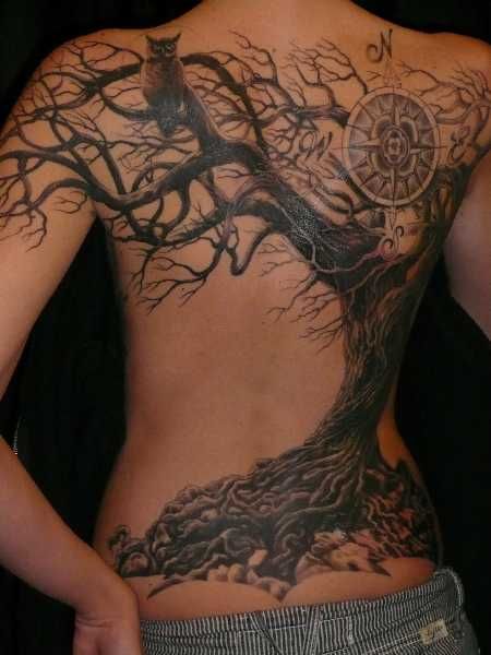 Tree and compass tattoo on the back