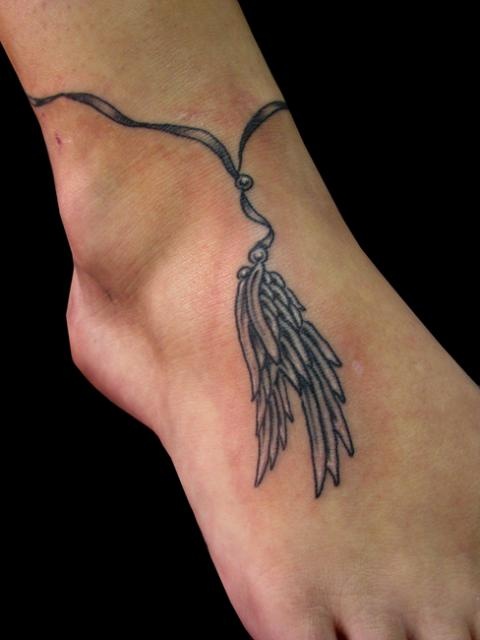 Wing tattoo on foot