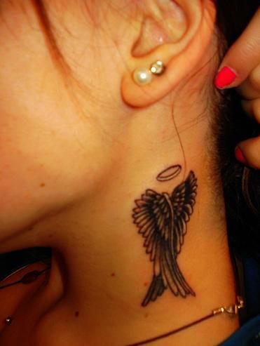 Wing tattoos behind the ears