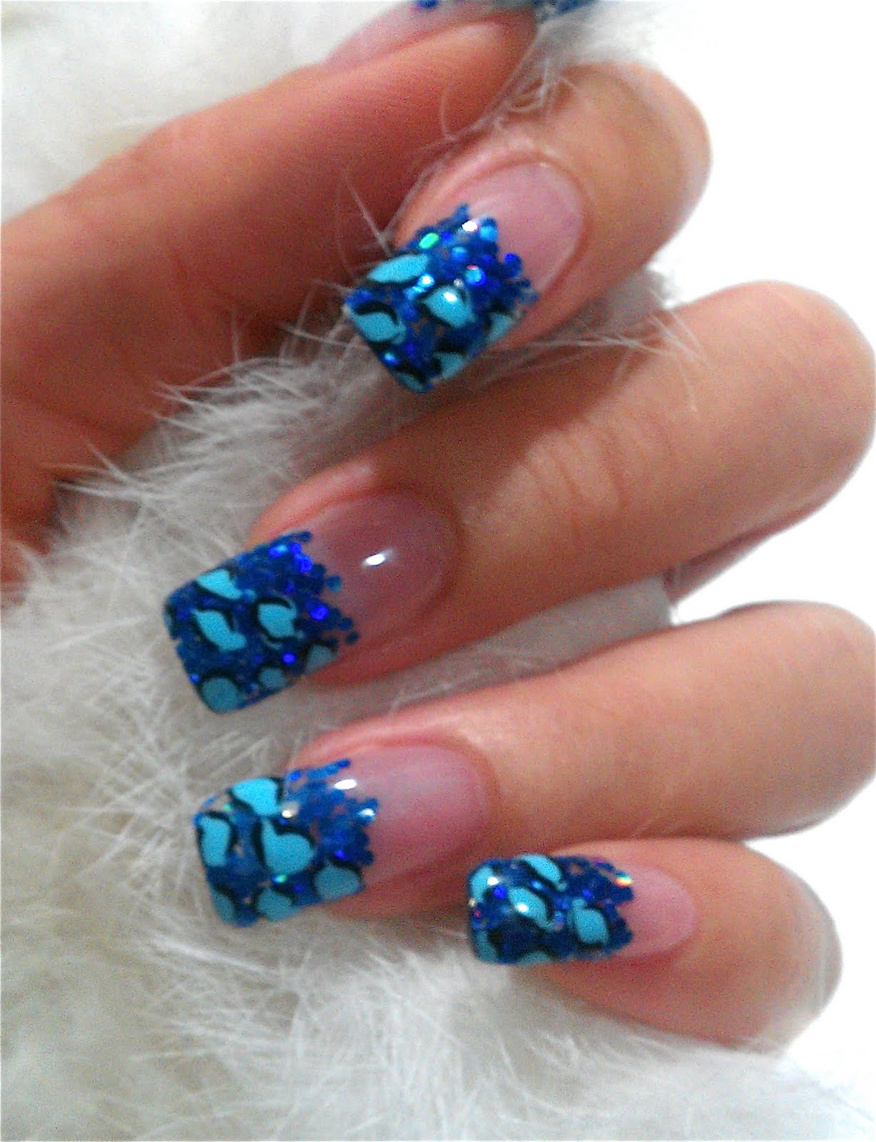 Glittering blue nail design