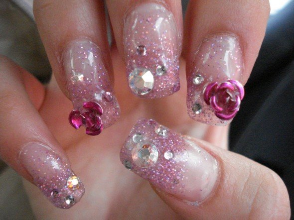 Glittering pink nail design with crystals