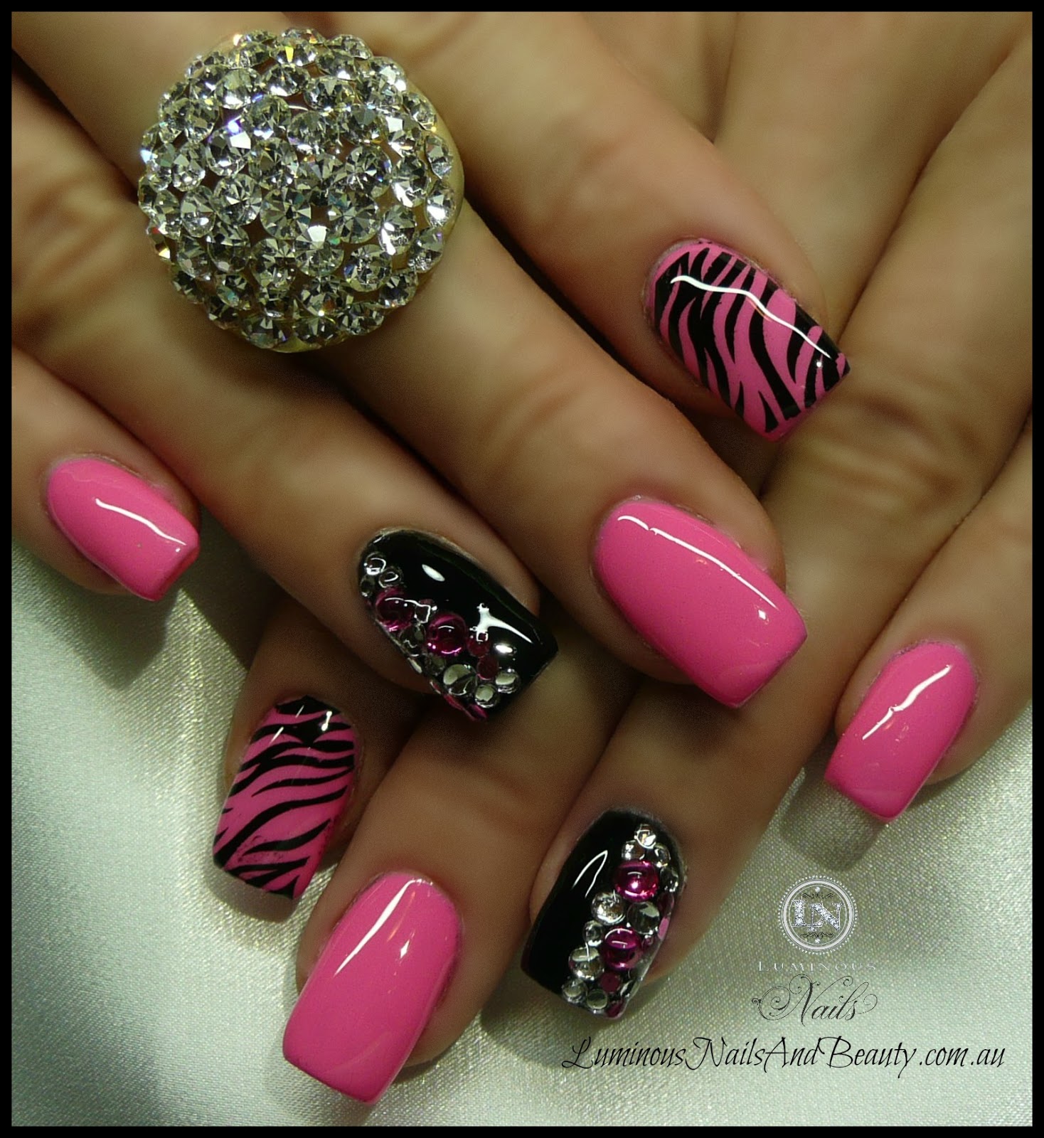 Bright pink animal print nail design