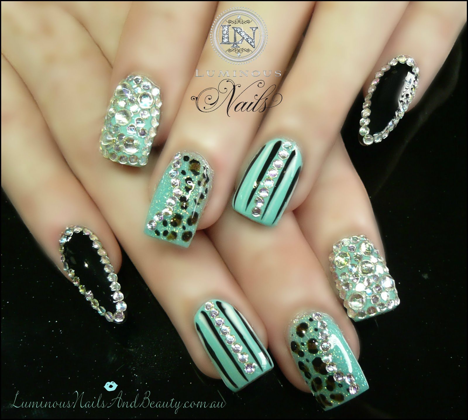 Black and mint decorated nail design